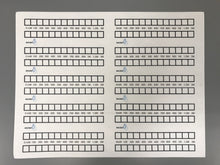 Load image into Gallery viewer, Sheet of titrators (black wax, acid-base labels, unbaked)